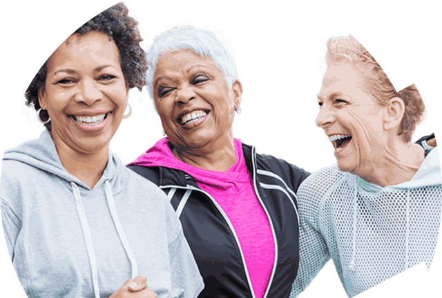 Three older women laughing together